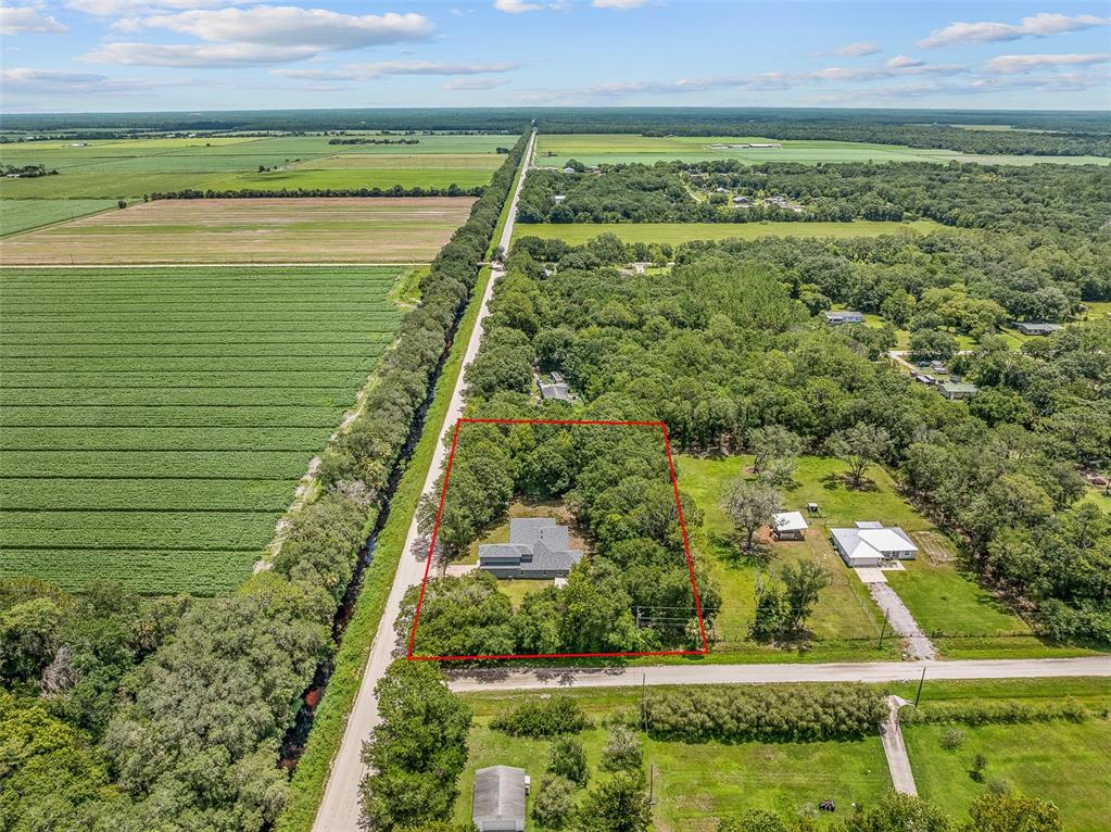 4191 Canal Avenue Bunnell, FL 32110 - Photo 5 of 81 a view of a yard with an outdoor space