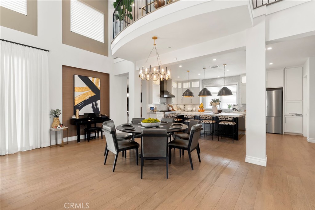 27716 Sycamore Mesa Road Temecula, CA 92590 - Photo 15 of 73 a view of a dining room with furniture and chandelier