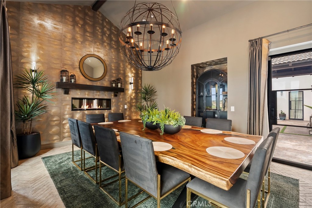 27716 Sycamore Mesa Road Temecula, CA 92590 - Photo 25 of 73 a view of a dining room with furniture and chandelier