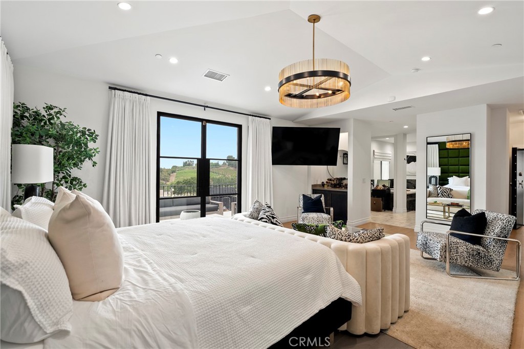 27716 Sycamore Mesa Road Temecula, CA 92590 - Photo 43 of 73 a bed room with a bed and a television