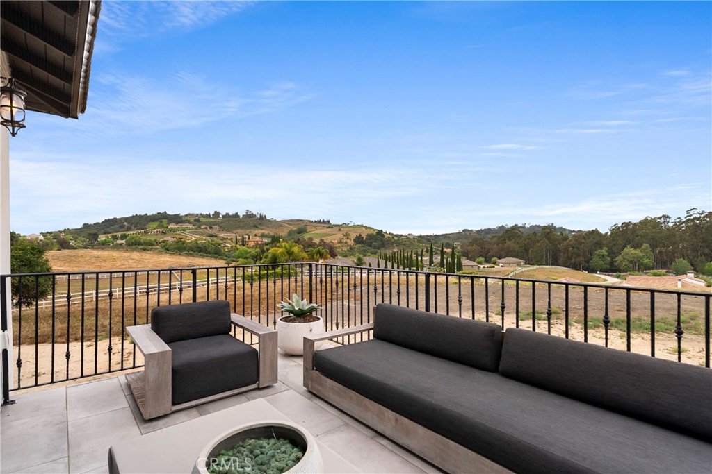 27716 Sycamore Mesa Road Temecula, CA 92590 - Photo 49 of 73 a roof deck with couches and wooden floor