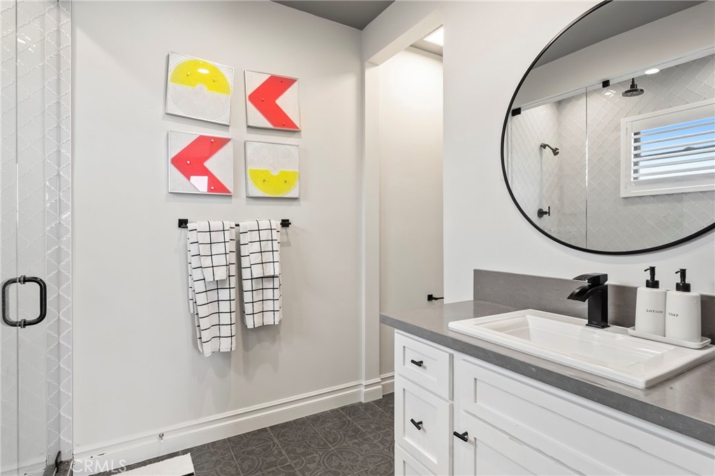 27716 Sycamore Mesa Road Temecula, CA 92590 - Photo 60 of 73 a bathroom with a sink a vanity and a mirror