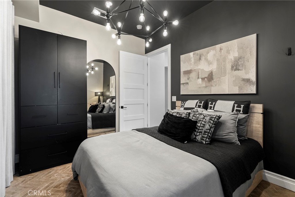 27716 Sycamore Mesa Road Temecula, CA 92590 - Photo 62 of 73 a bedroom with a bed and glass wall