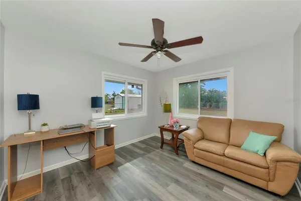 a living room with furniture and a window