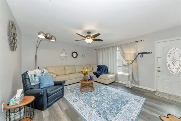a living room with furniture and a rug