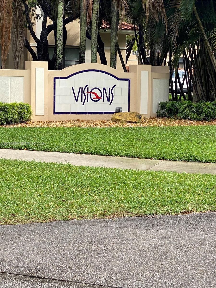 543 Racquet Club Road, Unit 33 Weston, FL 33326 - Photo 1 of 28 a street sign on the side of a building