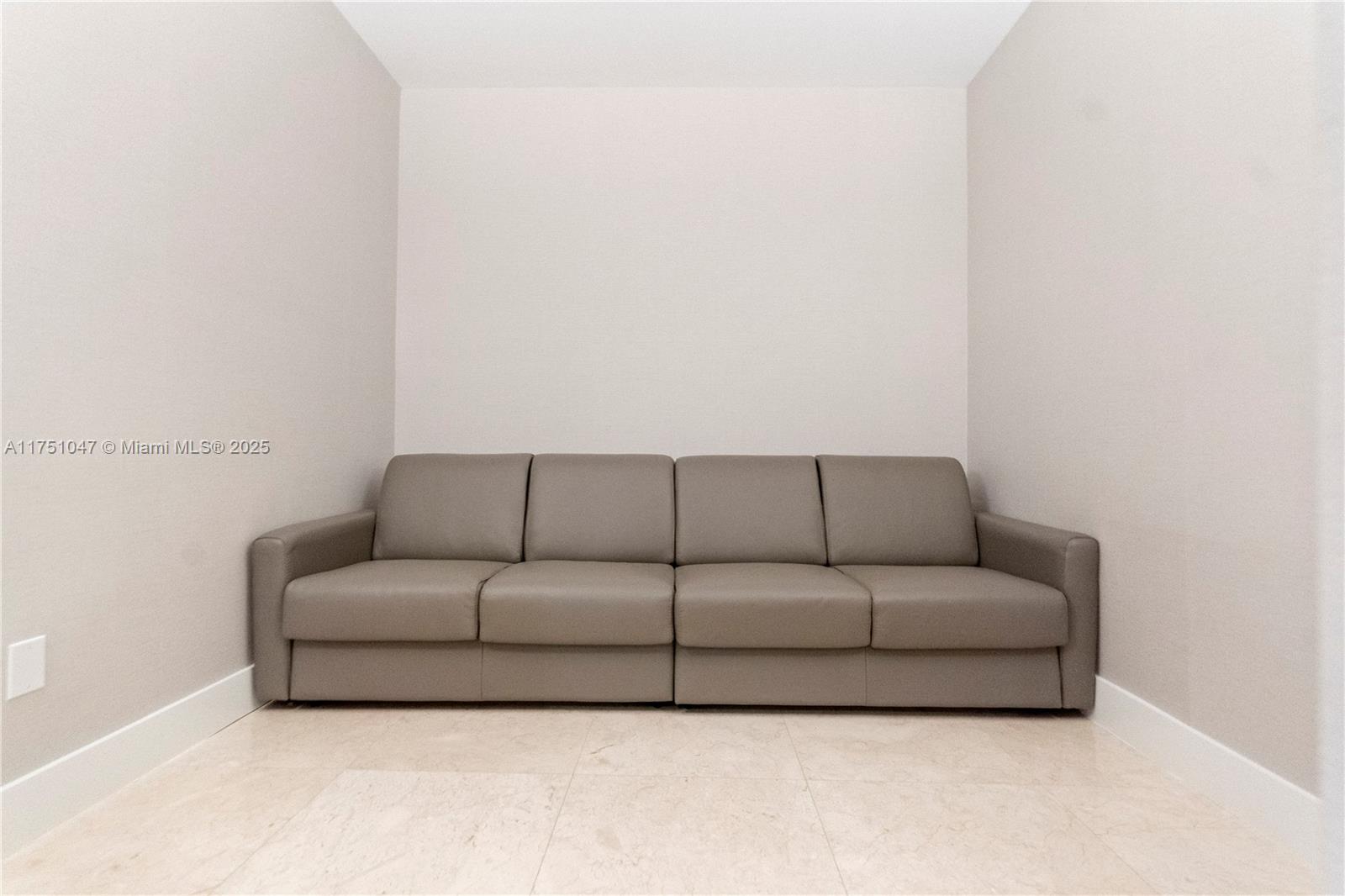 4779 Collins Avenue, Unit 2204 Miami Beach, FL 33140 - Photo 18 of 58 a living room with a couch