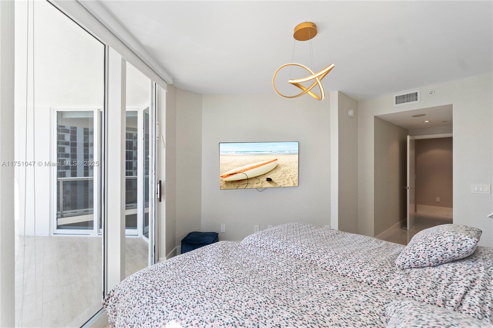 4779 Collins Avenue, Unit 2204 Miami Beach, FL 33140 - Photo 29 of 58 a bedroom with a bed and a window