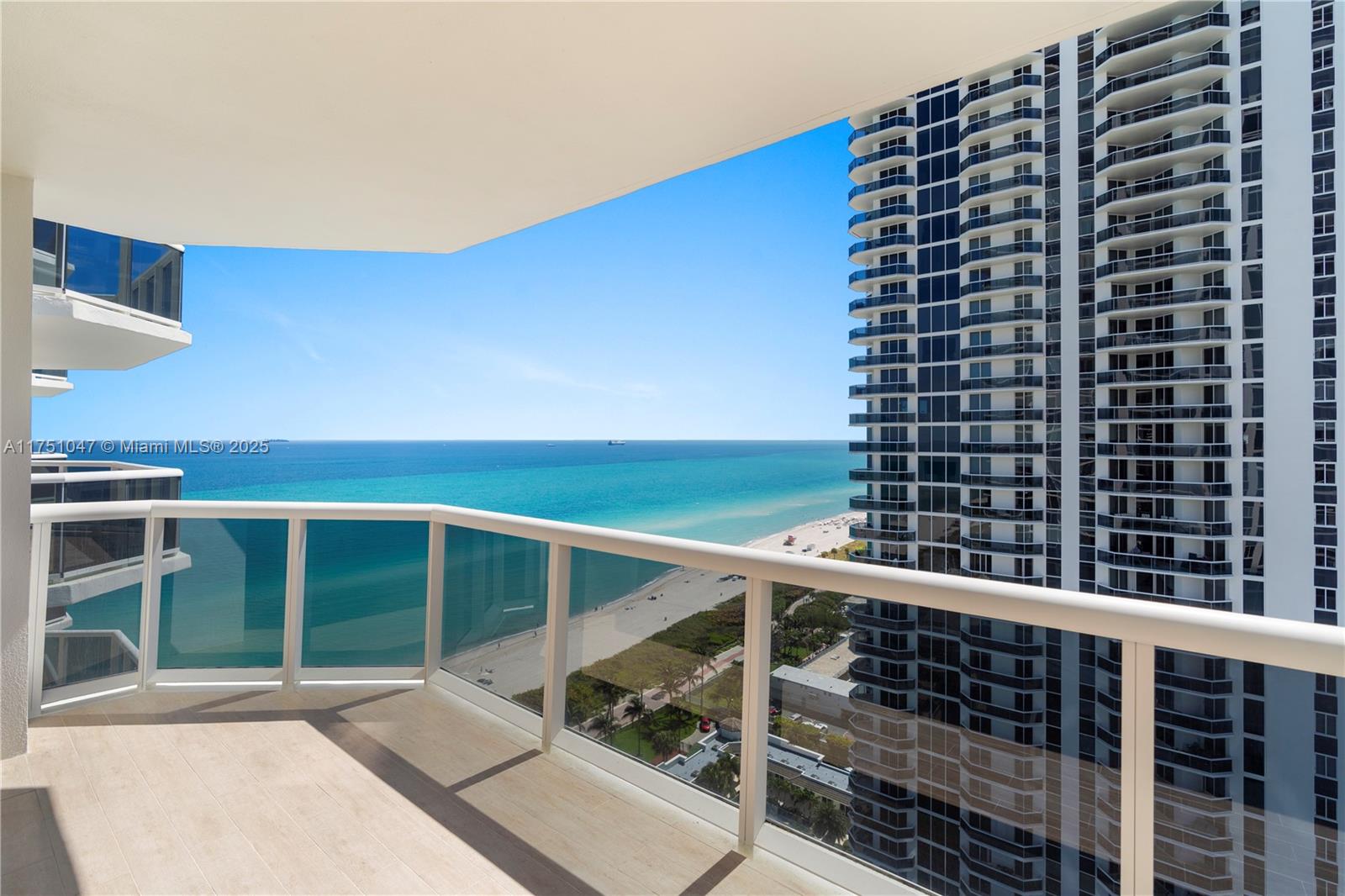 4779 Collins Avenue, Unit 2204 Miami Beach, FL 33140 - Photo 7 of 58 a view of balcony with wooden floor and windows