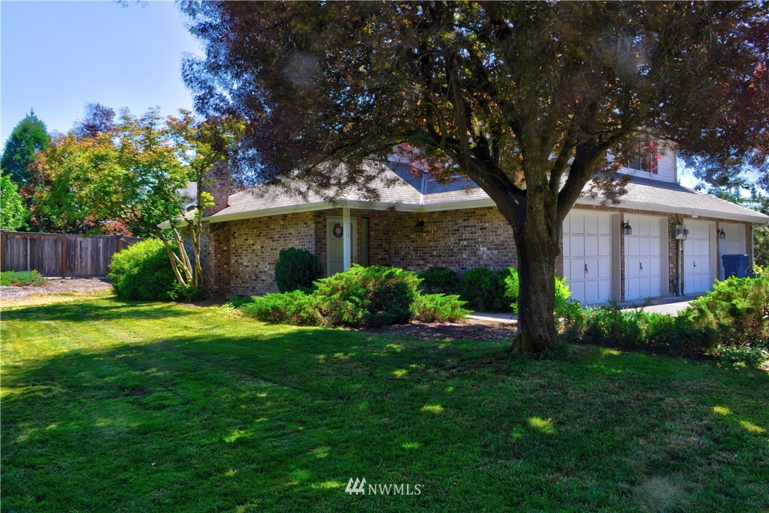 2631 180th Street Southeast, Unit 1&2 Bothell, WA 98012 - Photo 2 of 3 a view of a house with garden and a tree