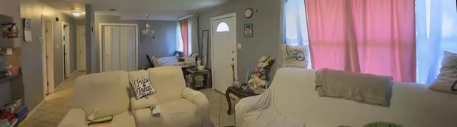 a bed room with a bed and a mirror