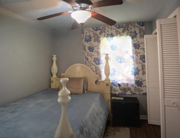 a bed room with a bed and a window