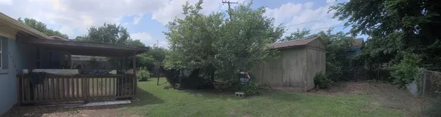 a view of backyard with green space