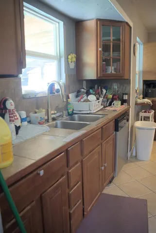 a kitchen with a sink and cabinets