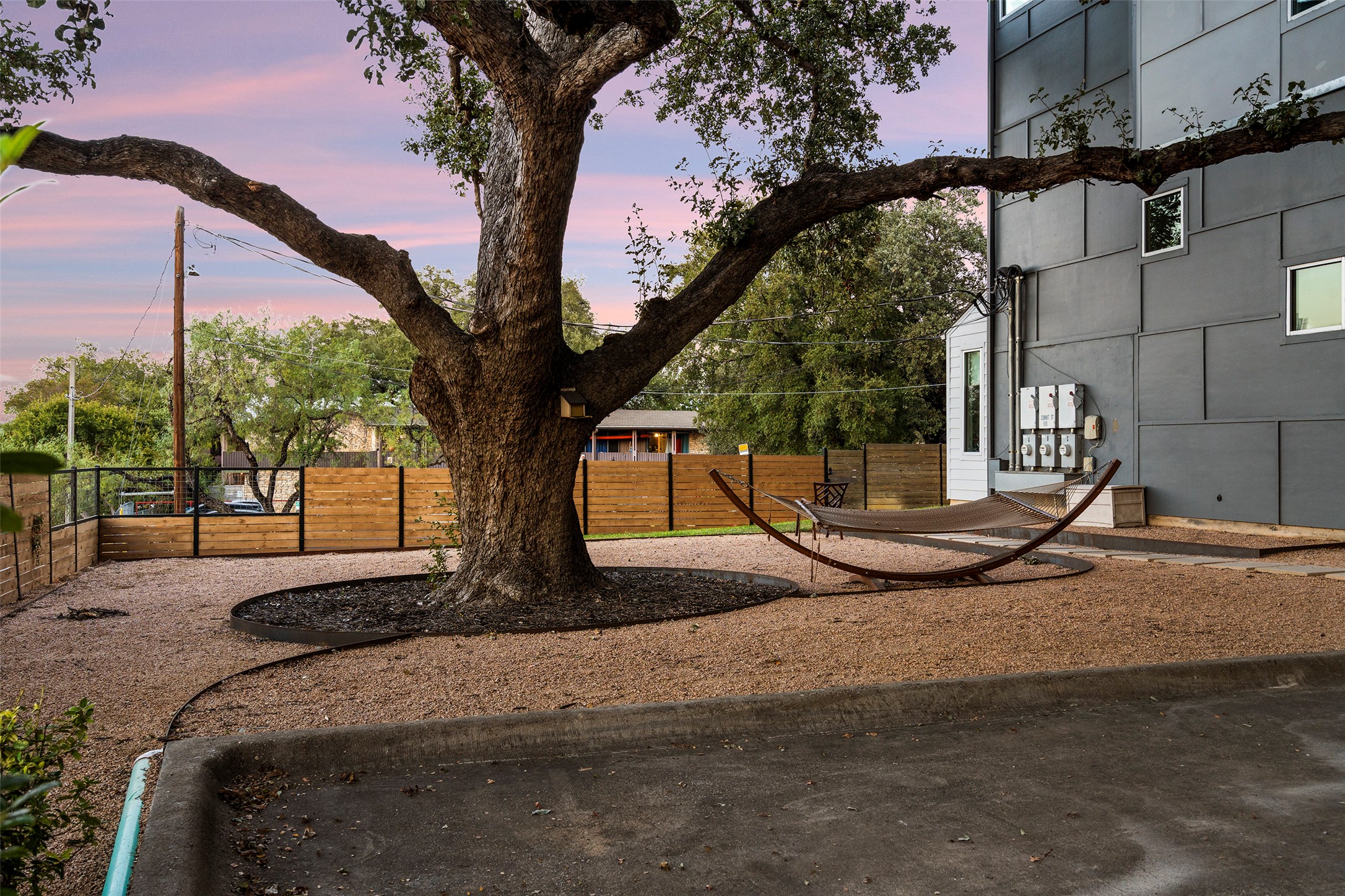 1500 Summit Street, Unit 5 Austin, TX 78741 - Photo 33 of 34 Yard at dusk with fence