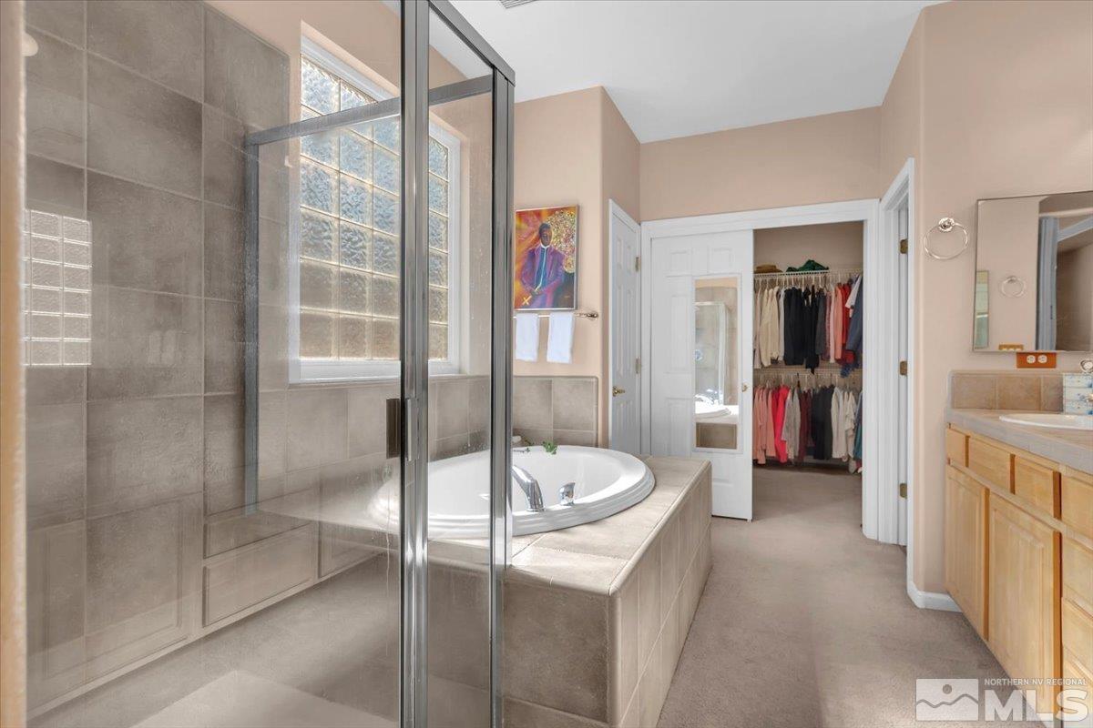 5670 Falcon Ridge Court Sparks, NV 89436 - Photo 20 of 40 a bathroom with a sink a toilet and shower