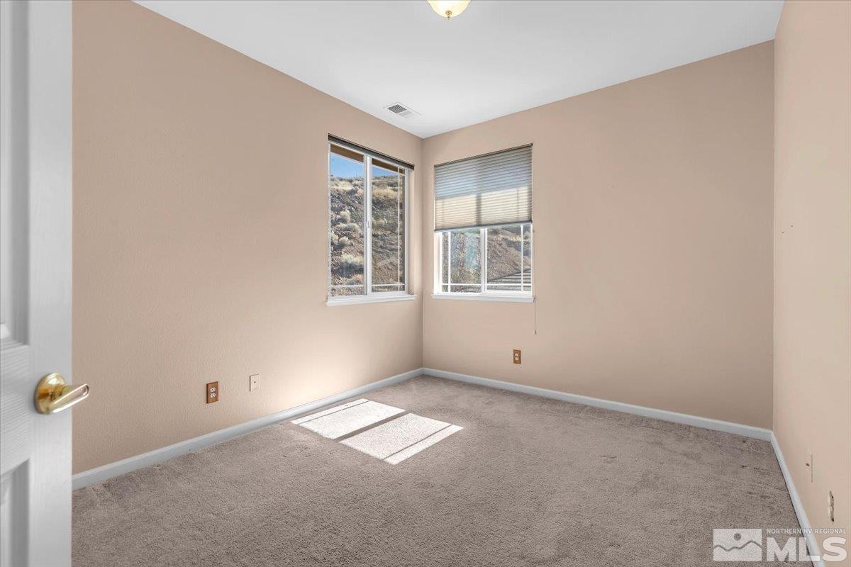 5670 Falcon Ridge Court Sparks, NV 89436 - Photo 30 of 40 an empty room with windows