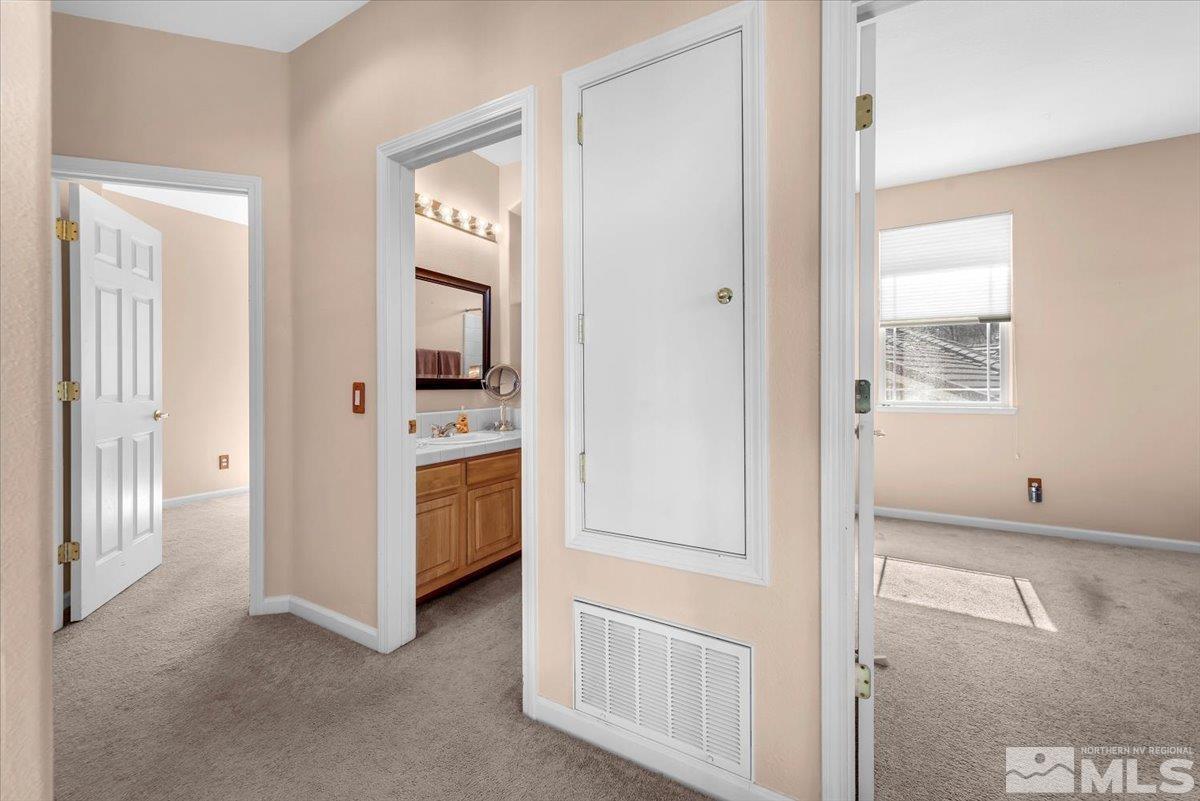 5670 Falcon Ridge Court Sparks, NV 89436 - Photo 31 of 40 a view of a hallway with kitchen and entryway