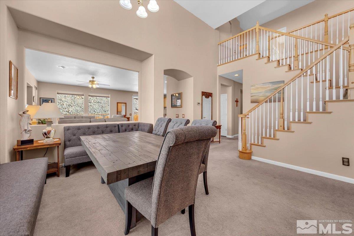 5670 Falcon Ridge Court Sparks, NV 89436 - Photo 6 of 40 a living room with furniture a table and chairs