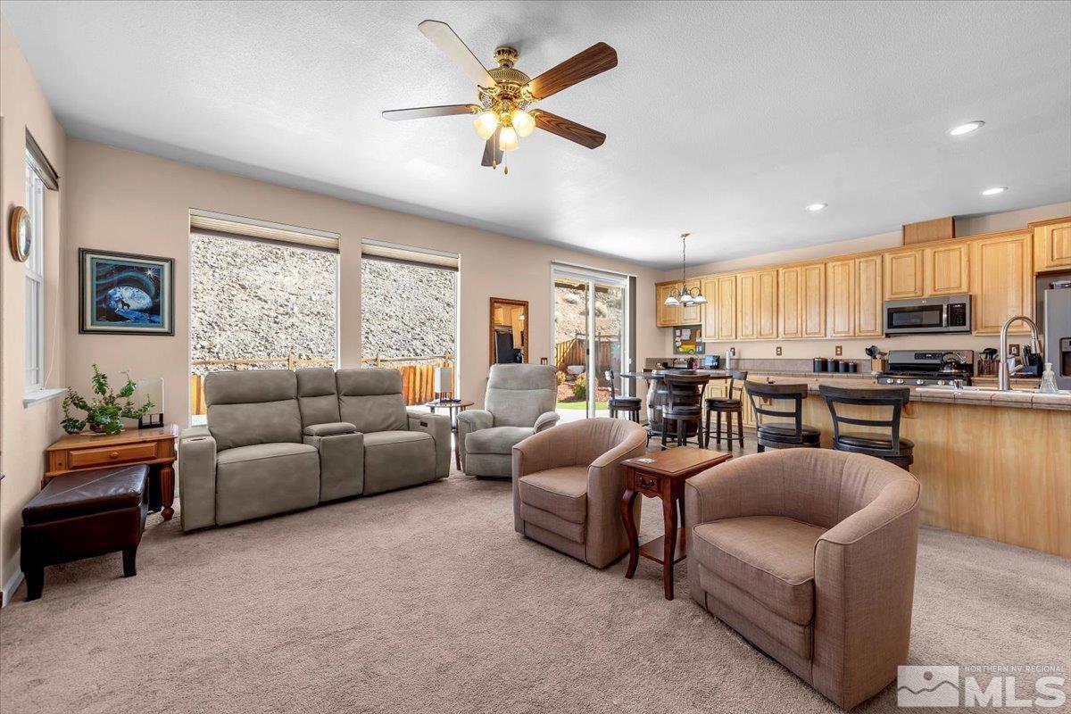 5670 Falcon Ridge Court Sparks, NV 89436 - Photo 9 of 40 a living room with furniture kitchen view and a window