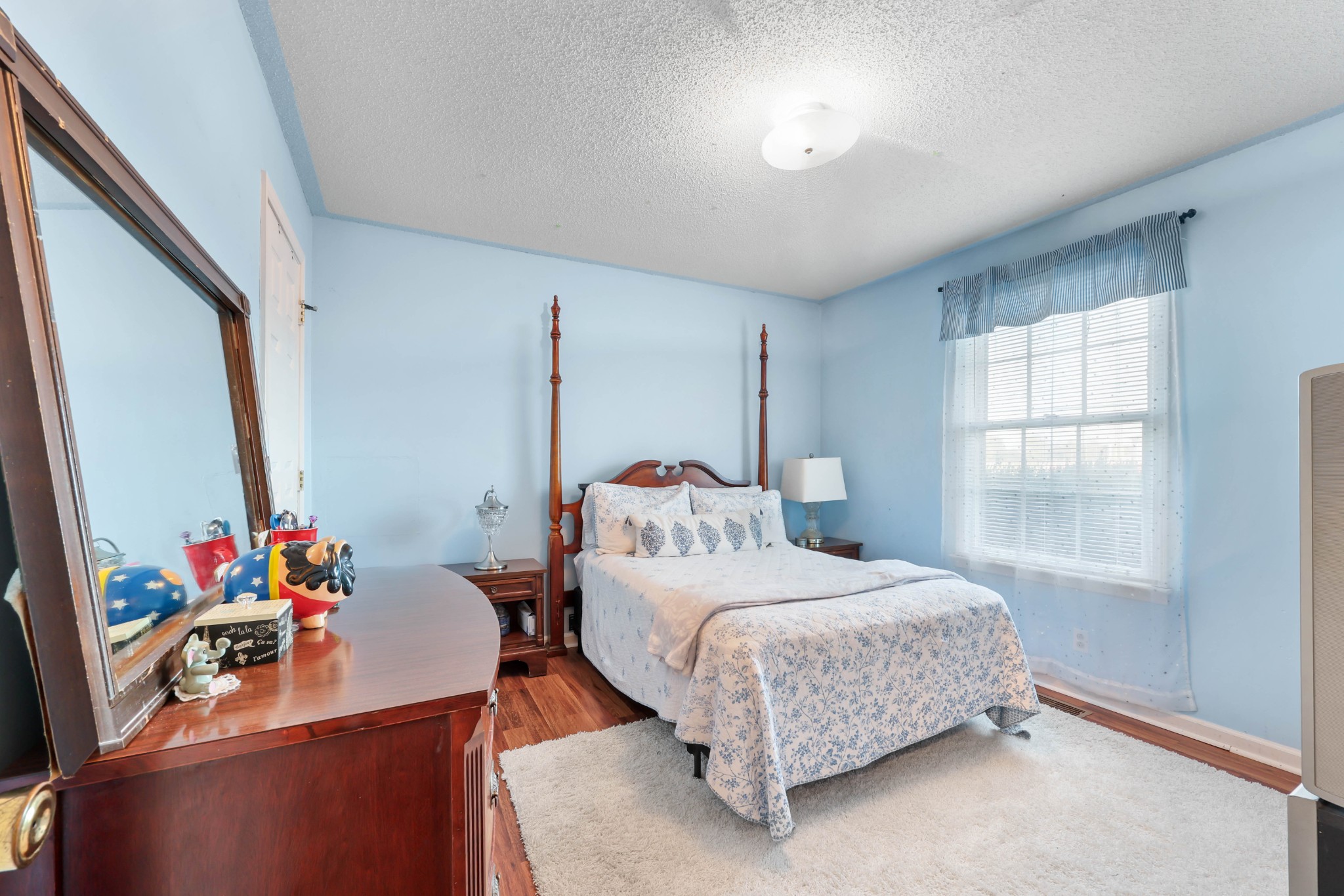 3702 Trenton Road Clarksville, TN 37042 - Photo 14 of 26 a bedroom with a bed table and a window
