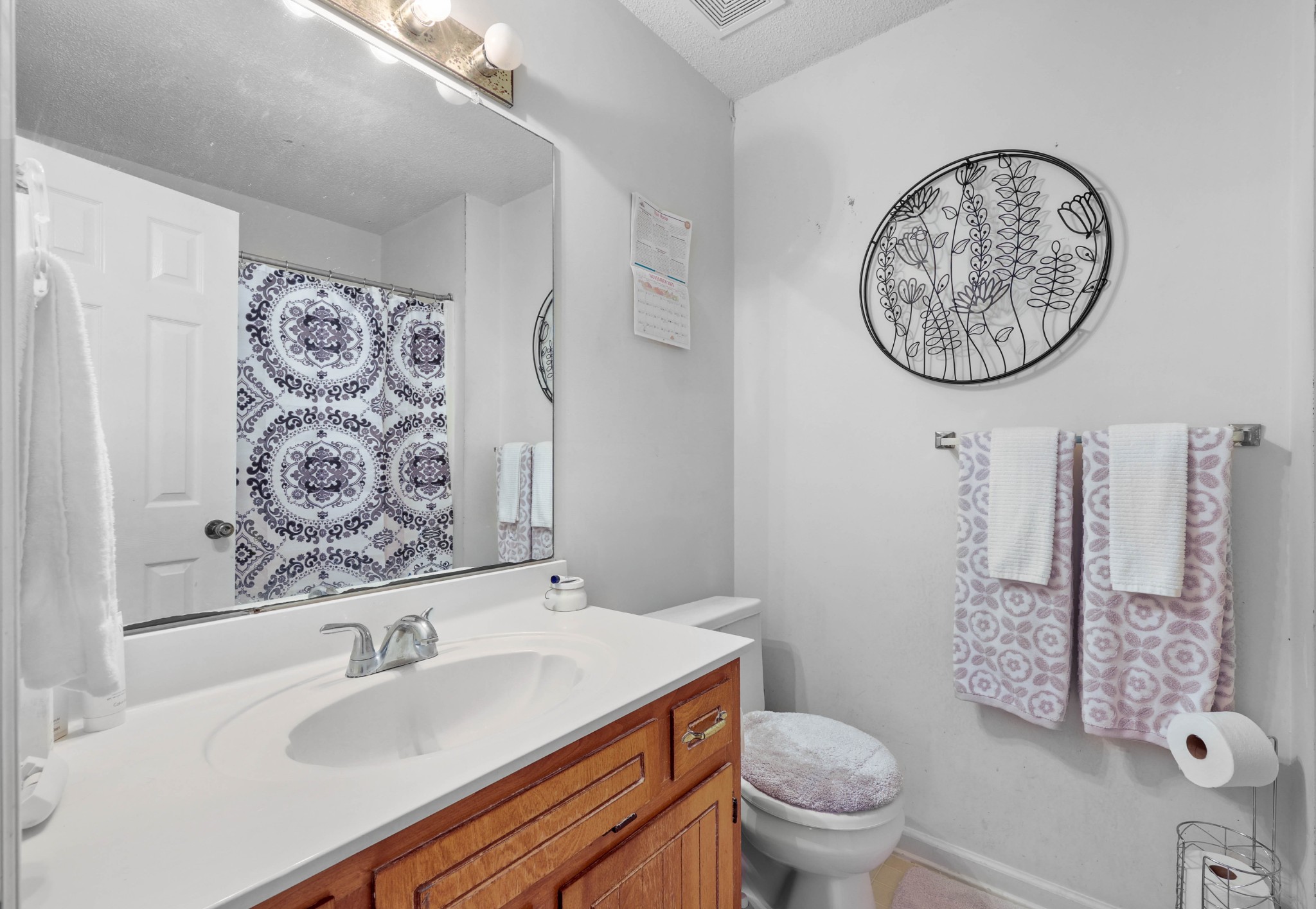 3702 Trenton Road Clarksville, TN 37042 - Photo 22 of 26 a bathroom with a toilet sink and mirror