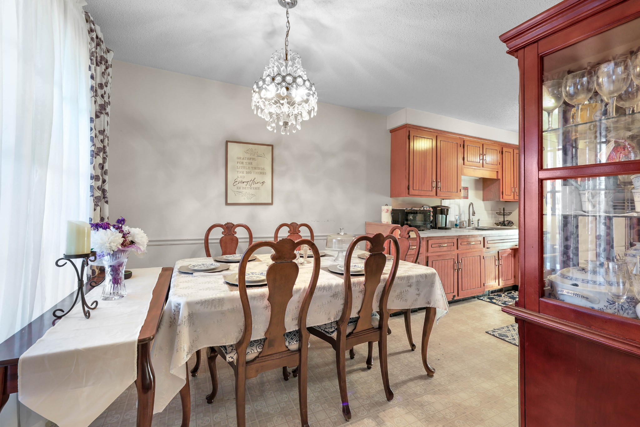 3702 Trenton Road Clarksville, TN 37042 - Photo 7 of 26 a view of a dining room with furniture a chandelier and window