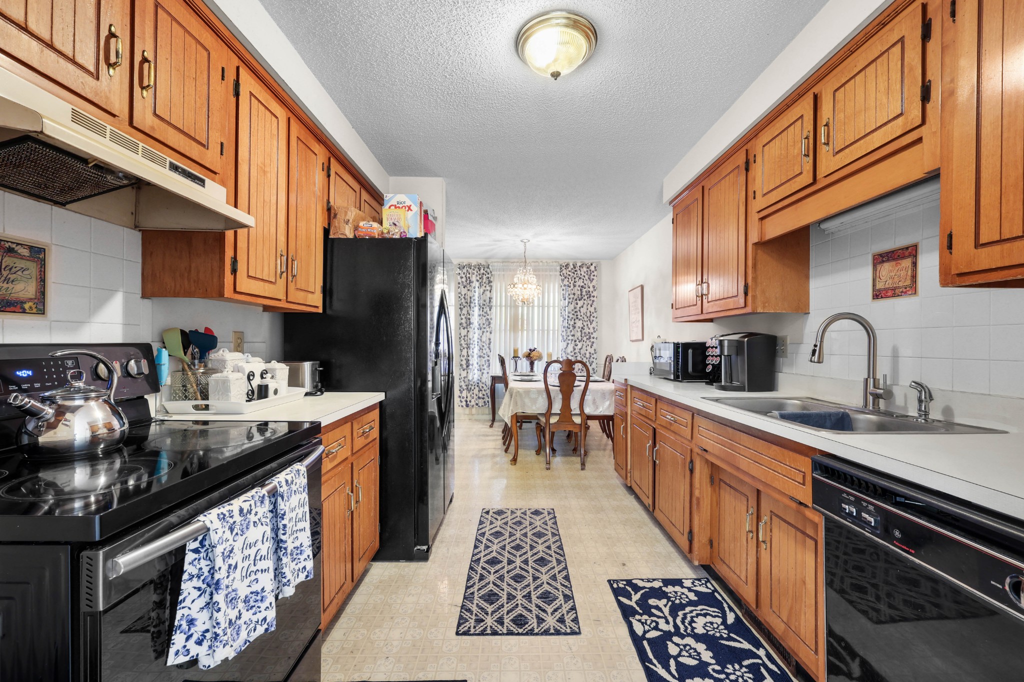 3702 Trenton Road Clarksville, TN 37042 - Photo 10 of 26 a kitchen with stainless steel appliances granite countertop a stove a sink dishwasher and cabinets with wooden floor