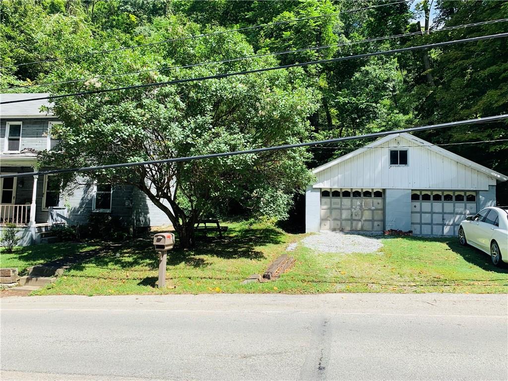 Farmhouse and 2 car detached garage