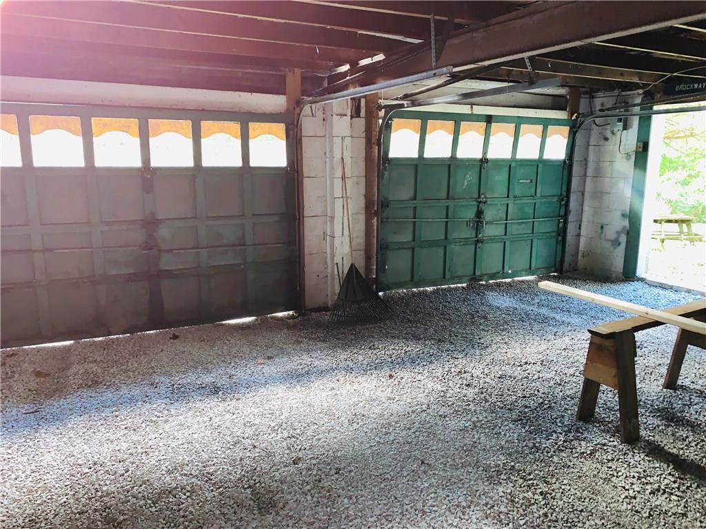 Interior of 2 car detached garage with gravel floor