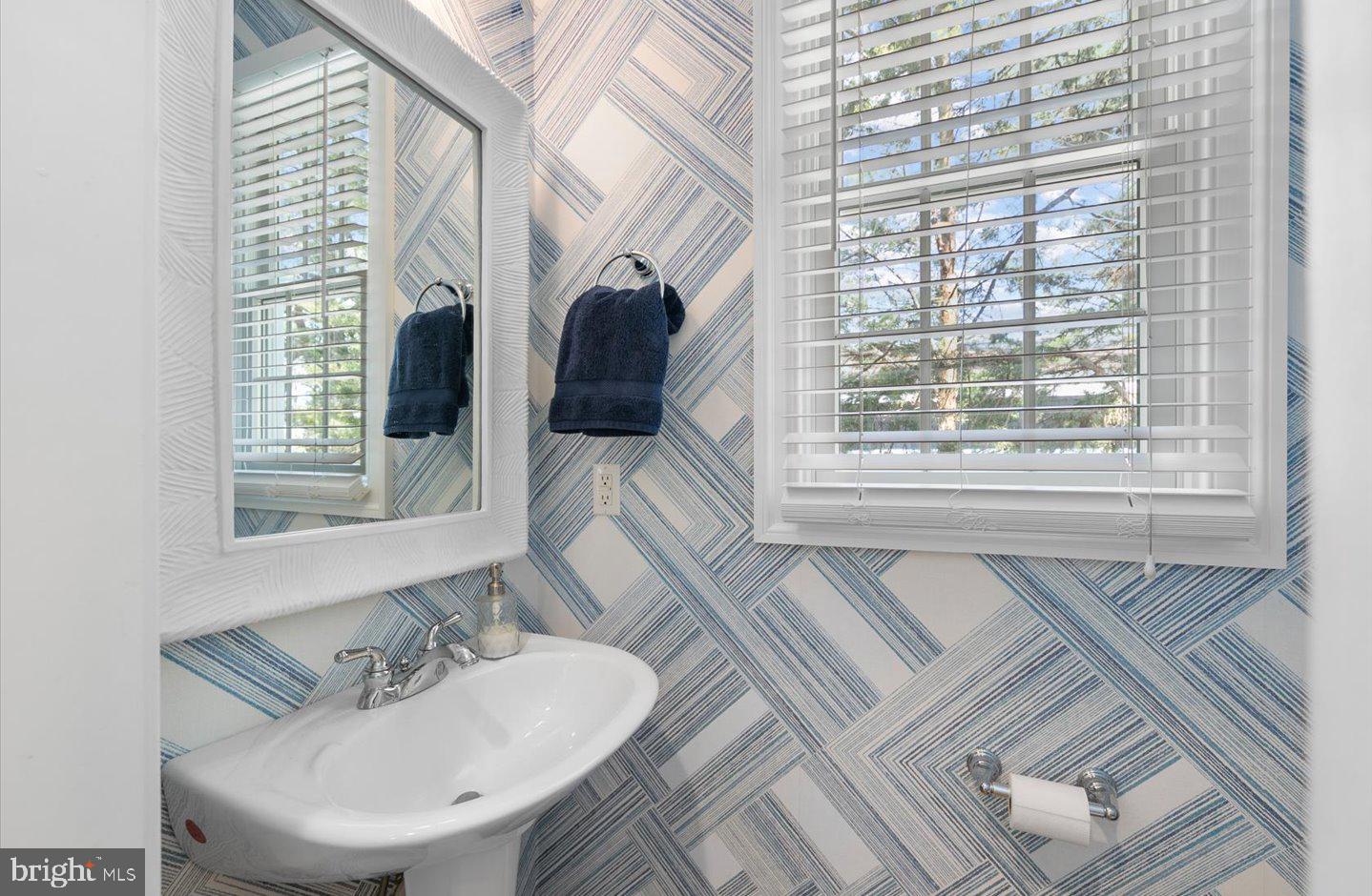 21 Cedar Road Rehoboth Beach, DE 19971 - Photo 29 of 59 a en suite bathroom with sink and mirror