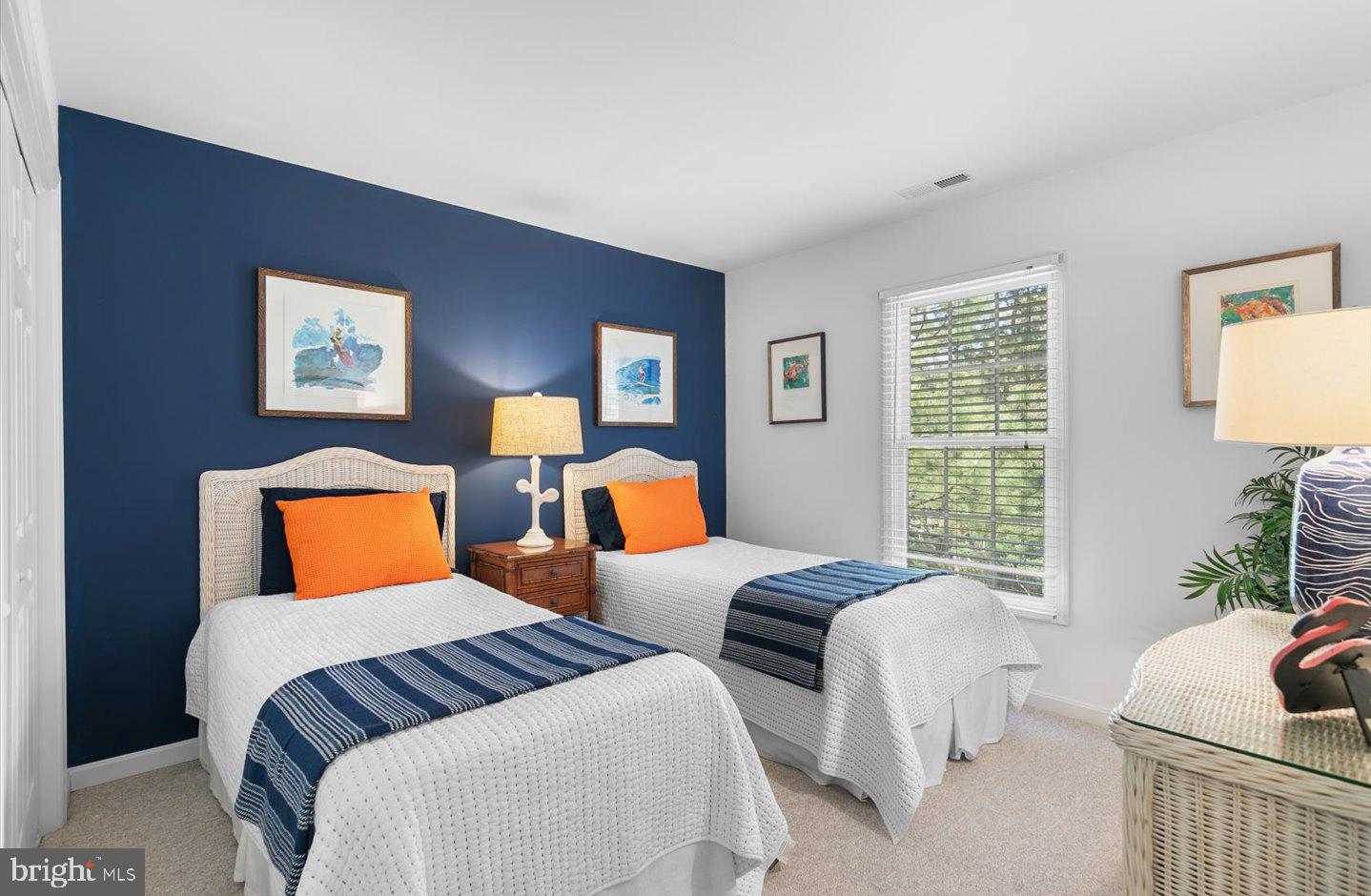 21 Cedar Road Rehoboth Beach, DE 19971 - Photo 32 of 59 a bedroom with two beds and a couch