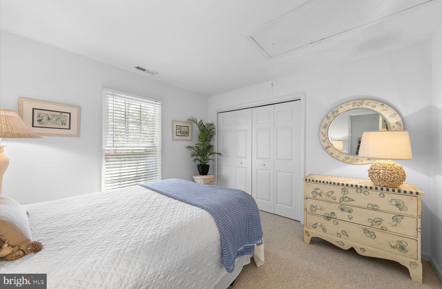 21 Cedar Road Rehoboth Beach, DE 19971 - Photo 37 of 59 a bedroom with a bed a dresser and mirror