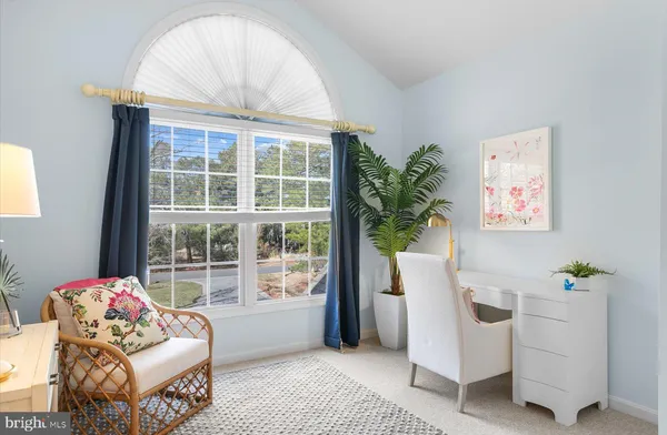 a view of walk in closet with clothes