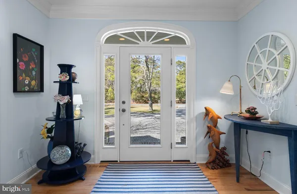 a view of entryway with wooden floor