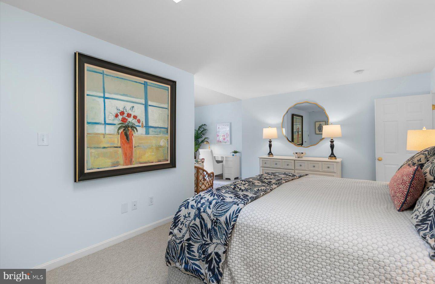 21 Cedar Road Rehoboth Beach, DE 19971 - Photo 45 of 59 a bedroom with a bed a painting on the wall and a window