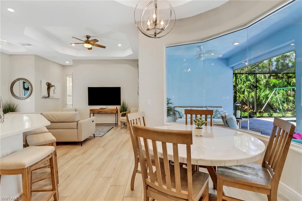 421 35th Avenue Northeast Naples, FL 34120 - Photo 13 of 39 a view of a dining room with furniture window and outside view