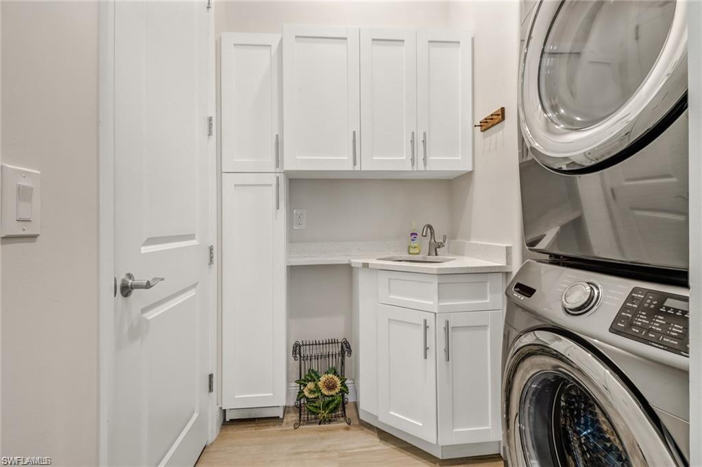 421 35th Avenue Northeast Naples, FL 34120 - Photo 28 of 39 a utility room with sink dryer and washer