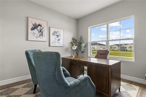 a dining room with furniture and window