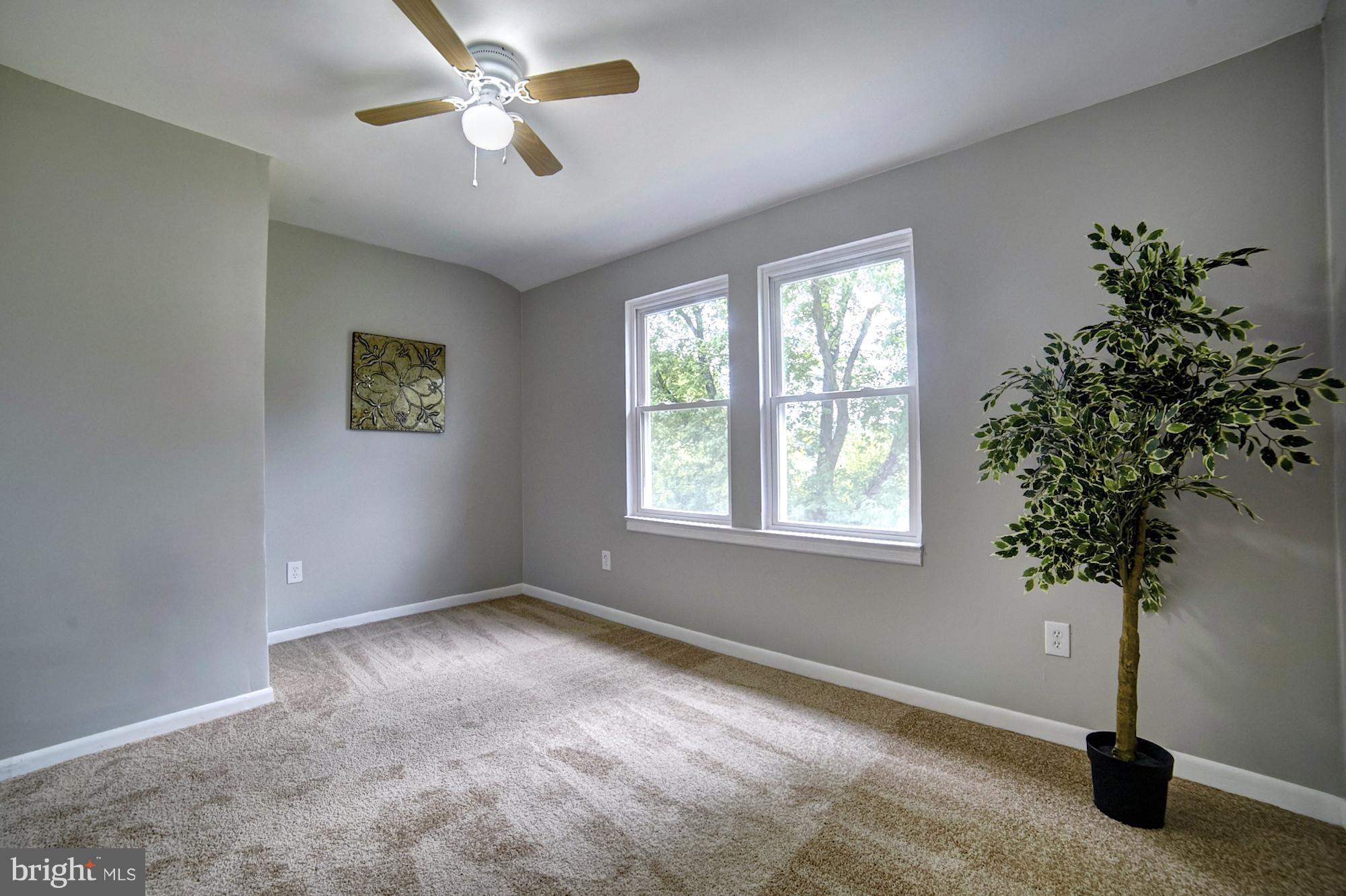 4008 Ridgecroft Road Baltimore, MD 21206 - Photo 13 of 17 a view of an empty room with a window