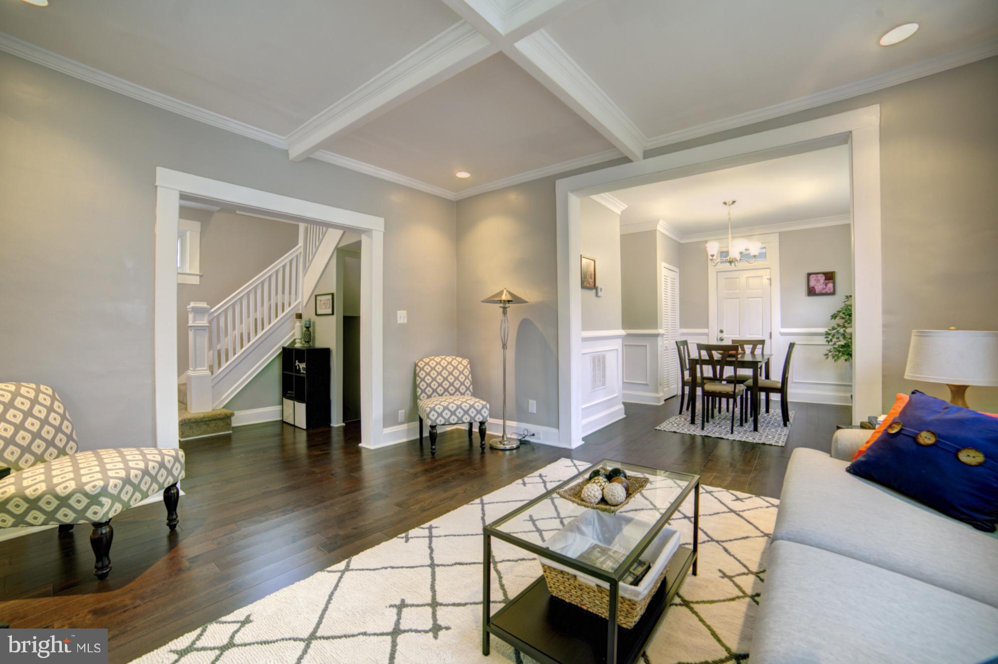4008 Ridgecroft Road Baltimore, MD 21206 - Photo 3 of 17 a living room with fireplace furniture and a wooden floor