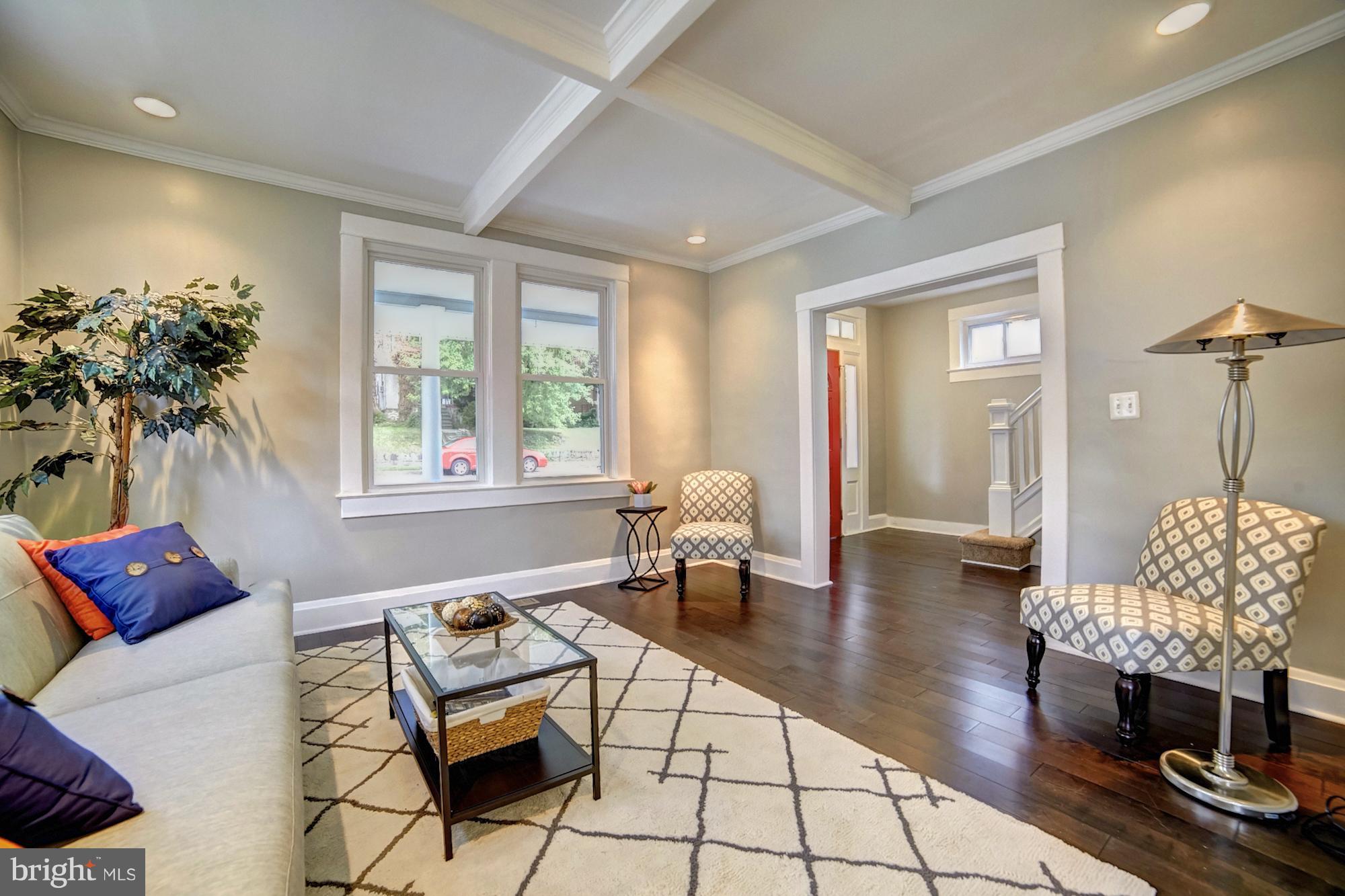 4008 Ridgecroft Road Baltimore, MD 21206 - Photo 5 of 17 a living room with furniture and wooden floor