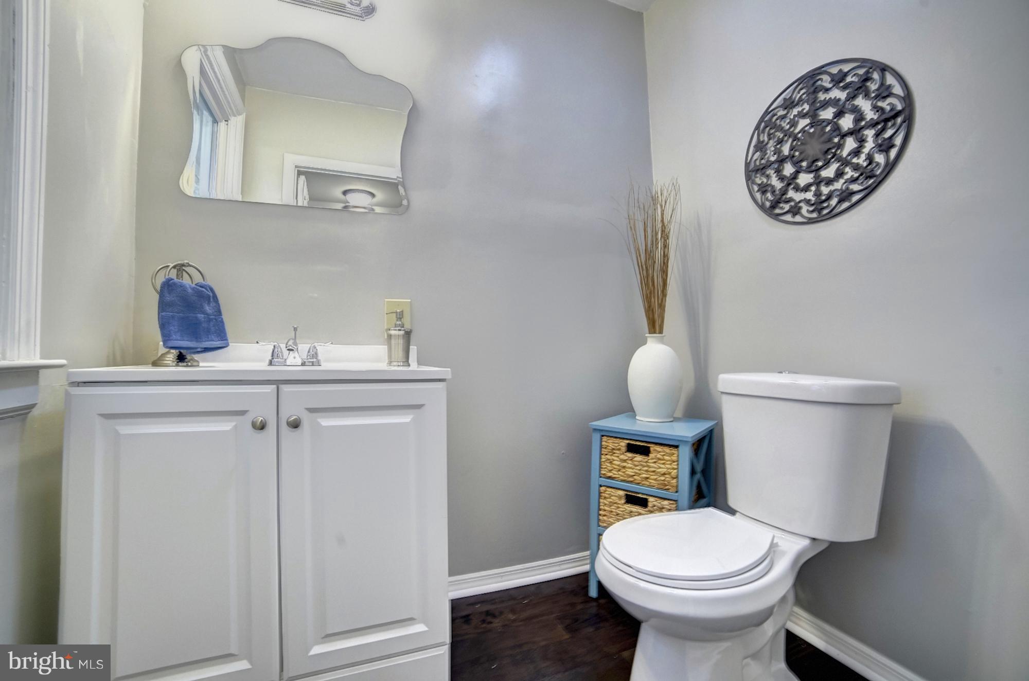 4008 Ridgecroft Road Baltimore, MD 21206 - Photo 9 of 17 a bathroom with a toilet sink and mirror