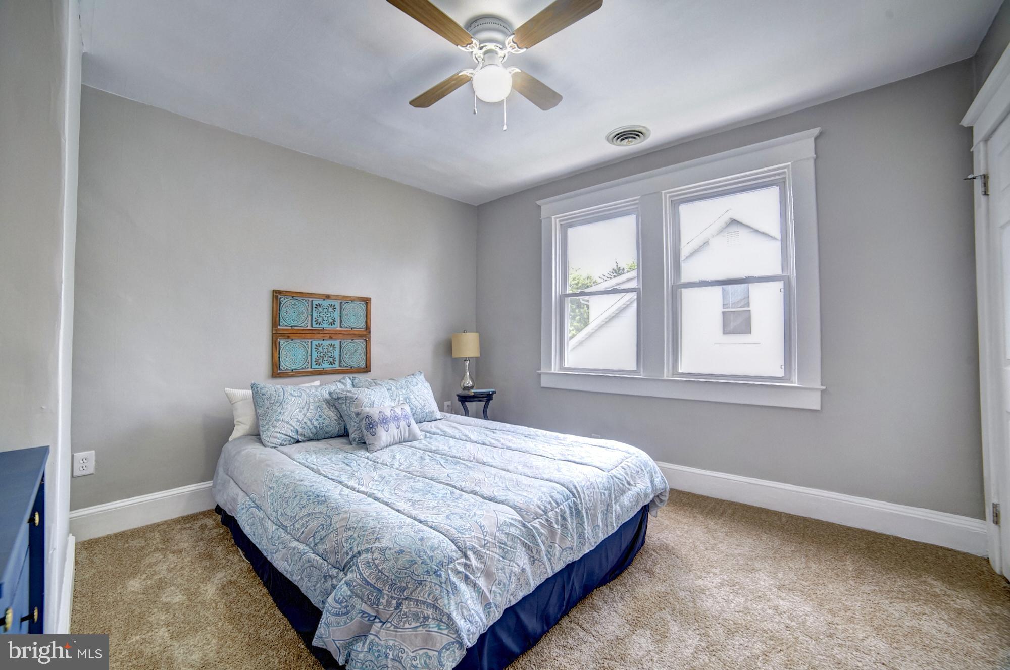 4008 Ridgecroft Road Baltimore, MD 21206 - Photo 10 of 17 a bedroom with a bed and a window