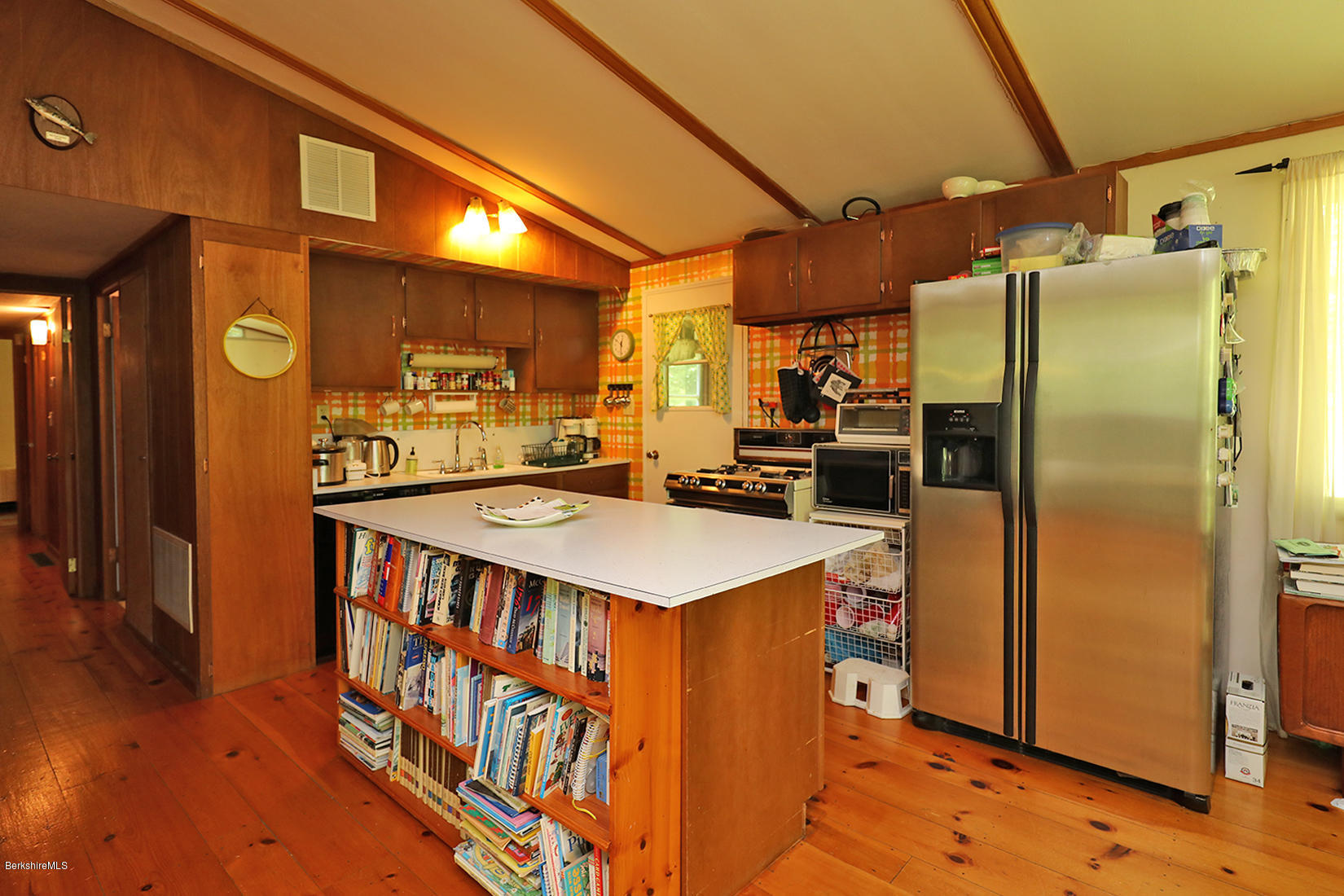 180 Kittle Road Hancock, MA 01267 - Photo 8 of 24 a kitchen with stainless steel appliances granite countertop a refrigerator a stove and a wooden floors