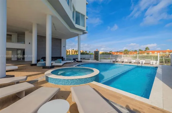 a balcony with table and chairs