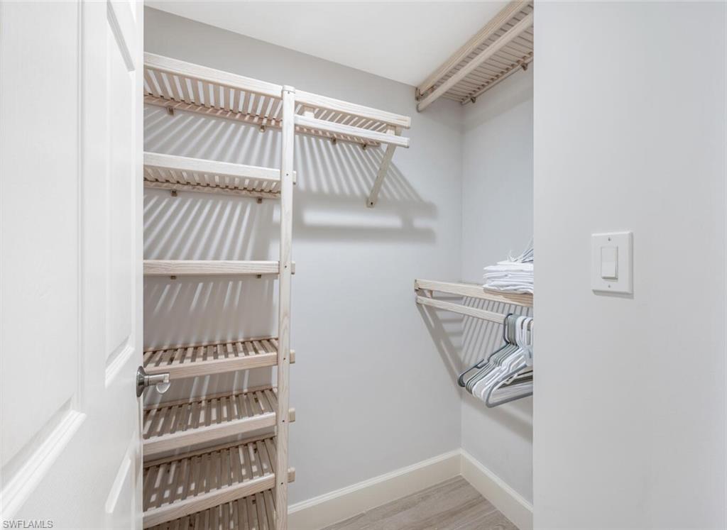 6849 Grenadier Boulevard, Unit 503 Naples, FL 34108 - Photo 22 of 50 a view of staircase with white walls and a window