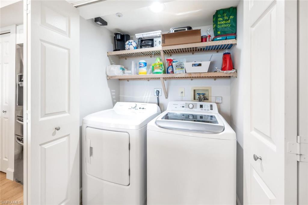 6849 Grenadier Boulevard, Unit 503 Naples, FL 34108 - Photo 29 of 50 a utility room with dryer and washer