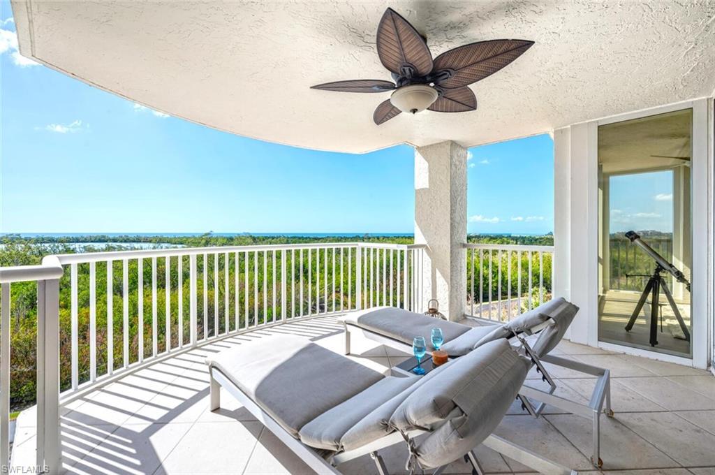 6849 Grenadier Boulevard, Unit 503 Naples, FL 34108 - Photo 31 of 50 a living room with a large window