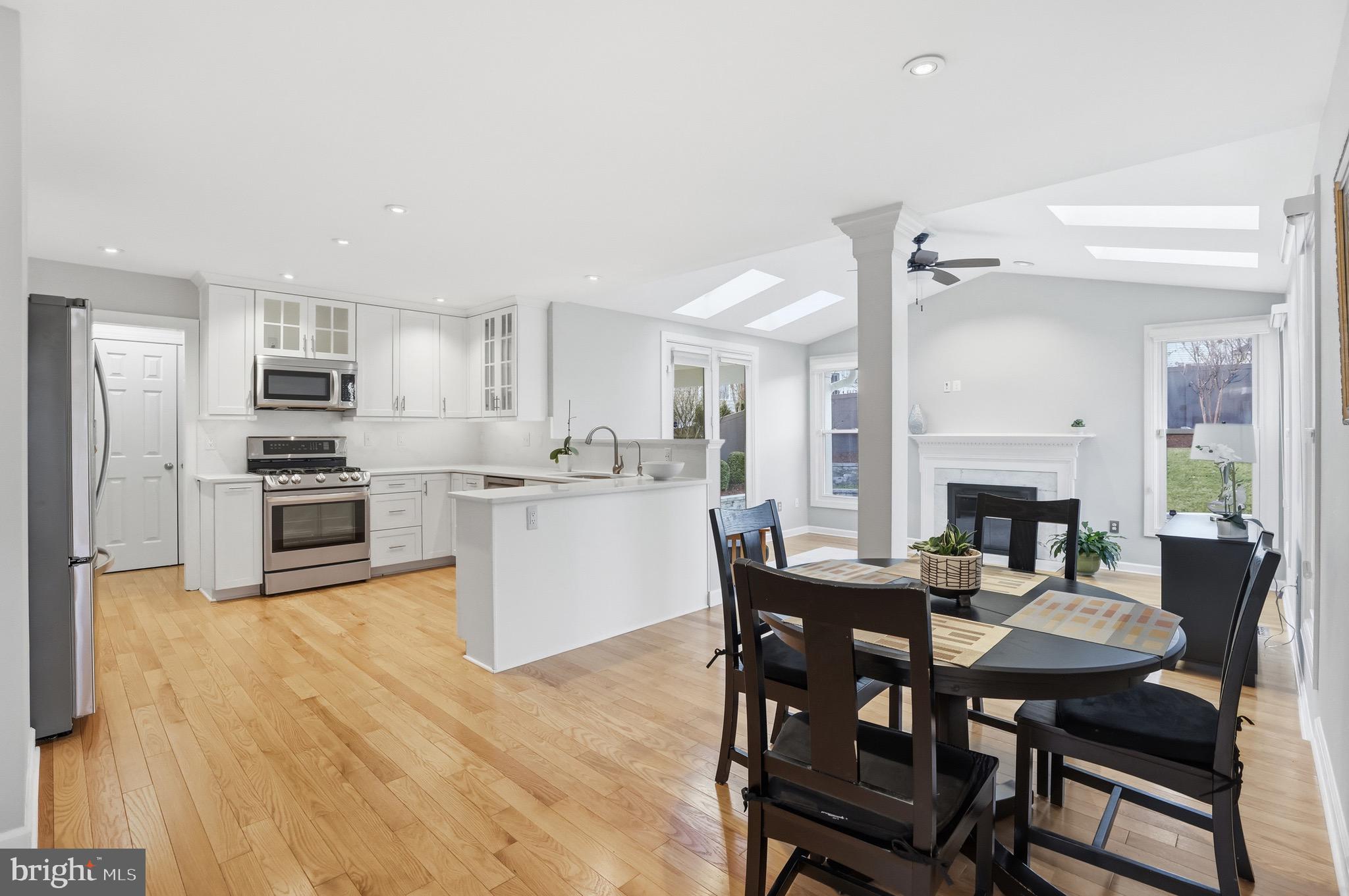 13222 Maplecrest Drive Potomac, MD 20854 - Photo 12 of 61 a view of a dining room with furniture and a kitchen